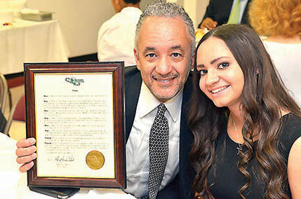Johnny Bailey and daughter Alexandria accept Links Inc. honor for Bob Bailey.